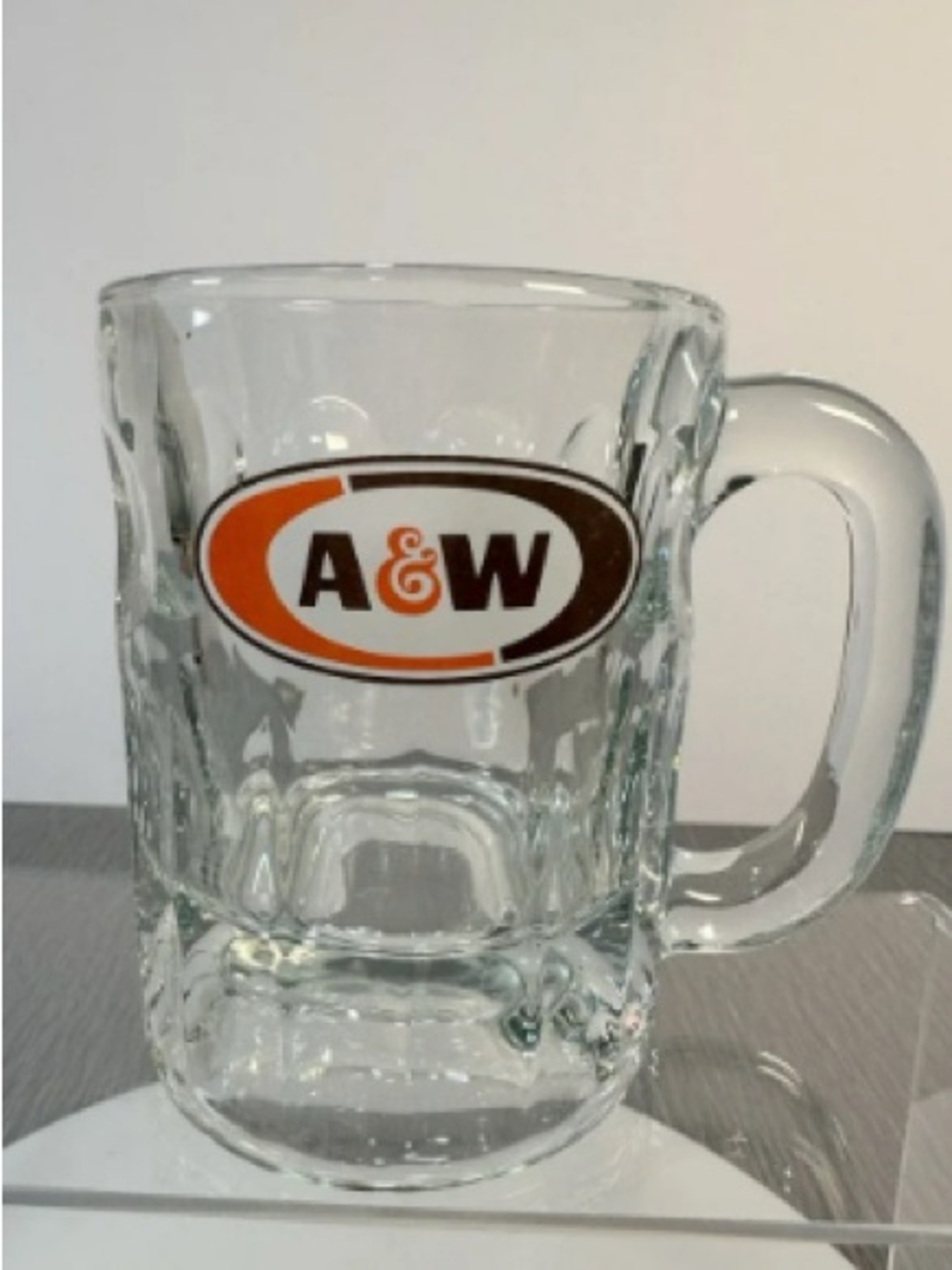 Branded Clear Glass Beer Mug with Orange and Brown Logo